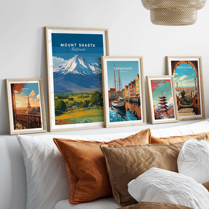 Framed Mount Shasta California print among other travel artwork in a cozy living room setting.