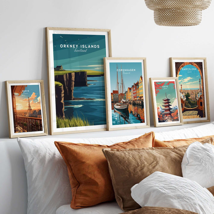 Framed Orkney Islands Sea Cliffs print among other travel posters, showcasing coastal Scotland's beauty.