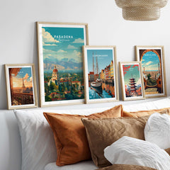 Pasadena California Print City Hall - San Gabriel Mountain Poster displayed among other city prints on a cozy bed.