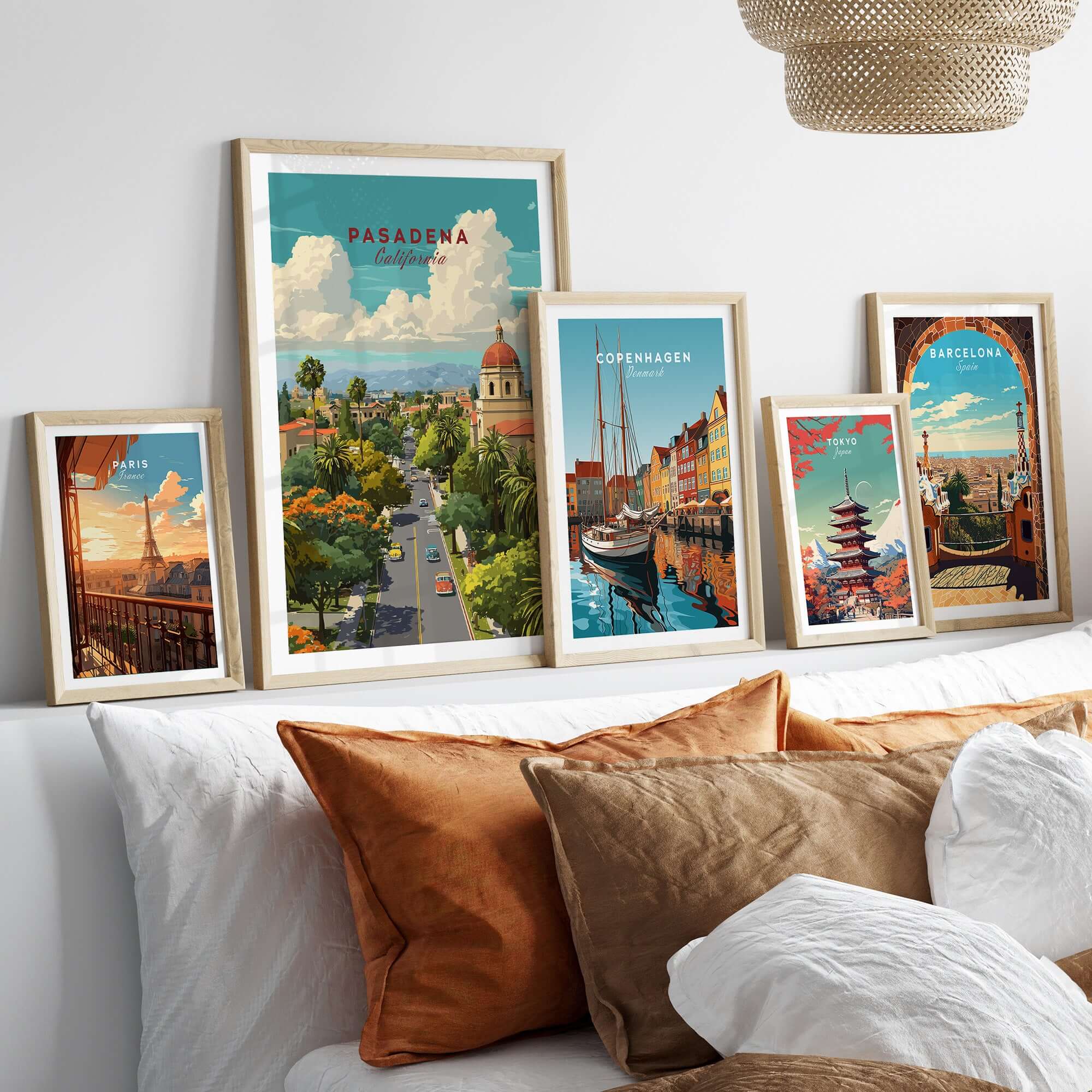 Pasadena Poster California - Cityscape Print displayed among framed cityscape posters on a stylish couch.