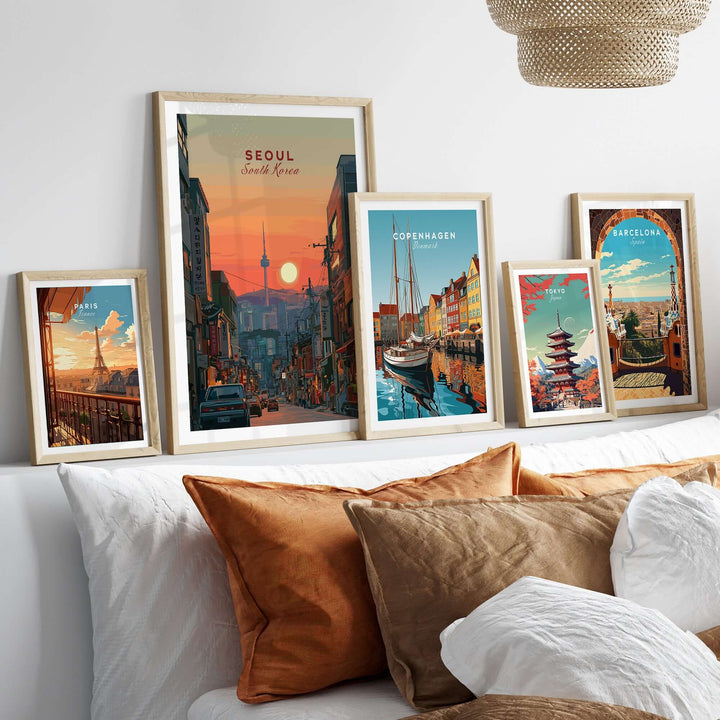 Seoul sunset skyline print featuring N Seoul Tower among framed cityscape artwork.