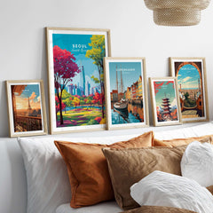 Seoul South Korea Poster - Vibrant Cityscape Print displayed among other cityscape prints on a stylish couch.