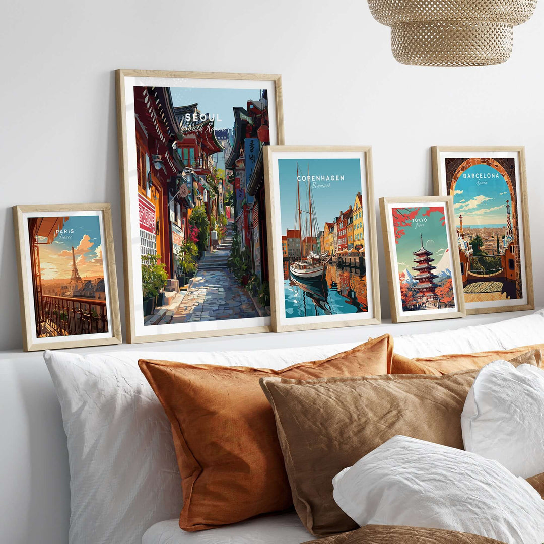 Framed Seoul South Korea print with colorful street scenes and architecture, displayed on a cozy home decor setting.
