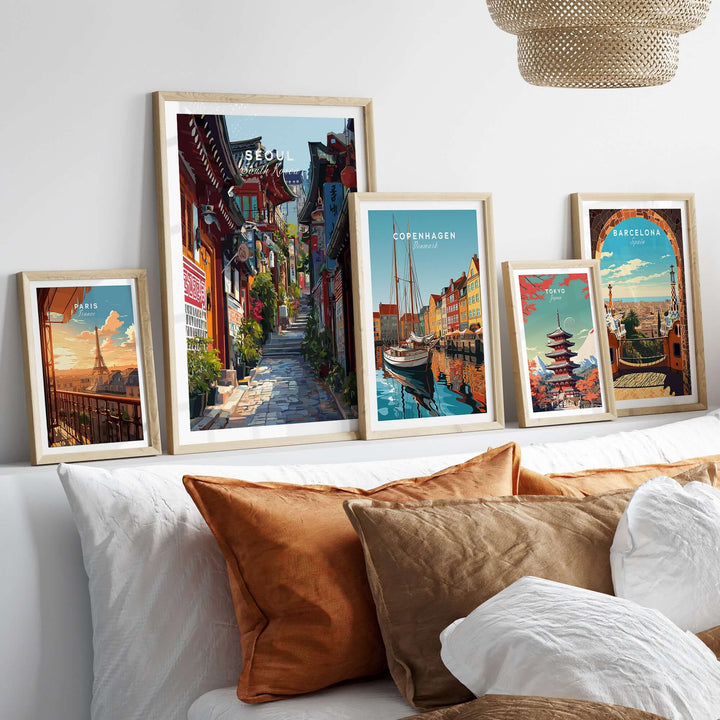 Framed Seoul South Korea print with colorful street scenes and architecture, displayed on a cozy home decor setting.