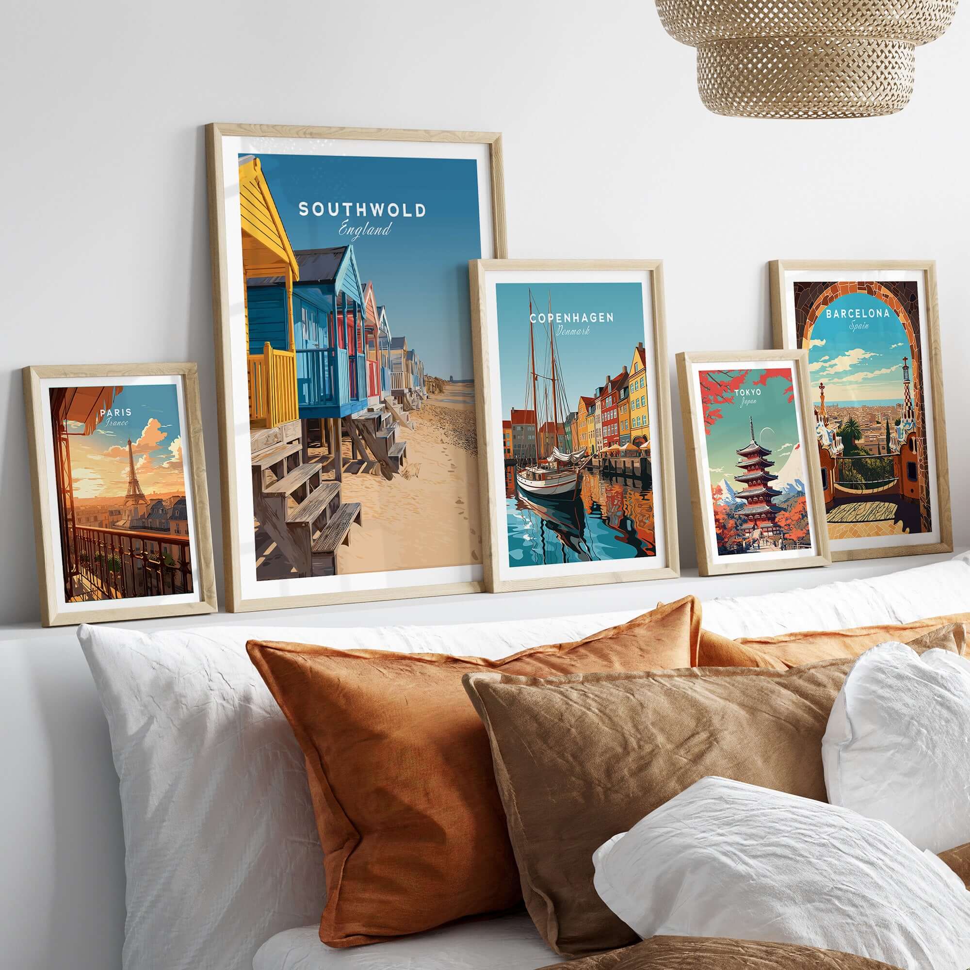 Image showcasing Southwold Print England among other travel posters on a cozy wall setup, capturing coastal charm.