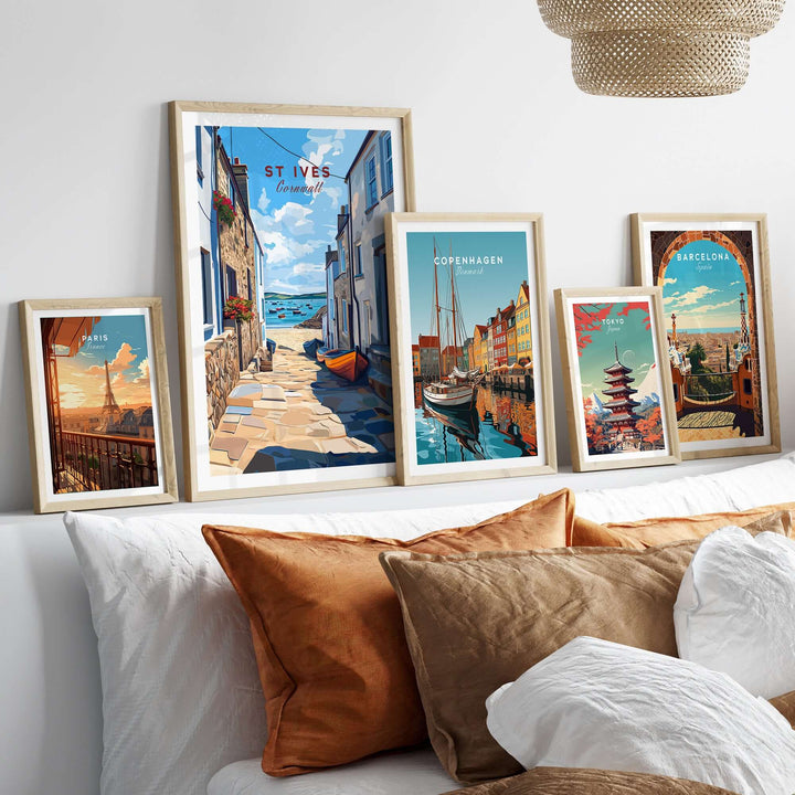Framed coastal town prints showcasing St Ives, Copenhagen, and Barcelona artwork in a stylish home setting.