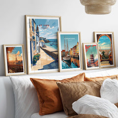 St Ives Cornwall Stone Steps to Beach Poster - Seaside Village Print displayed among other travel posters on a stylish bed.