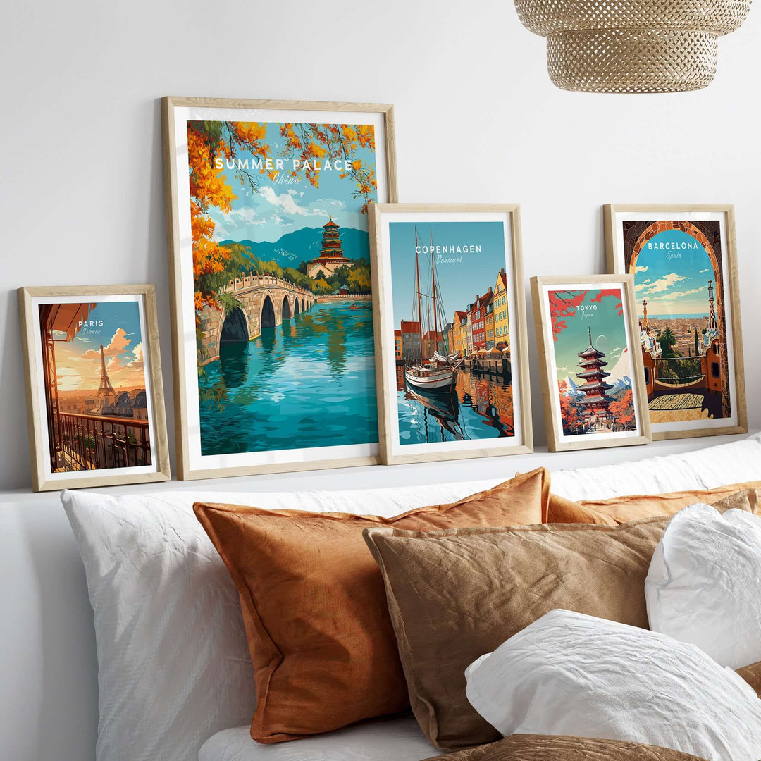 Framed prints of iconic landmarks including Summer Palace and cities like Copenhagen and Barcelona displayed on a couch.