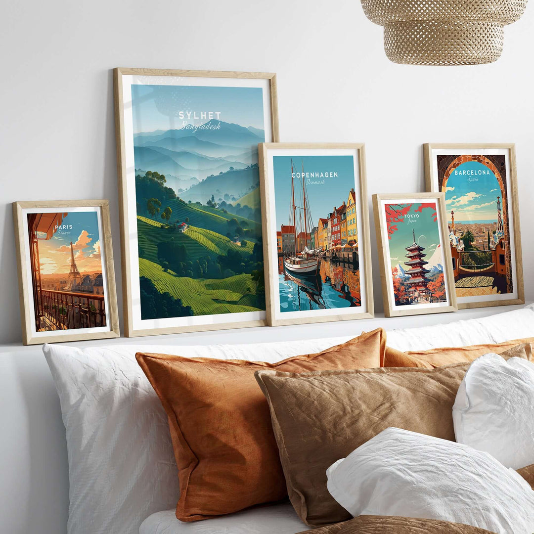 Sylhet Bangladesh tea fields print displayed among other travel posters in a cozy living room setting.