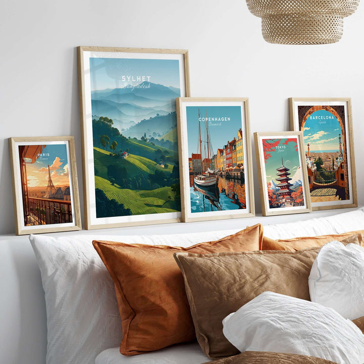 Sylhet Bangladesh tea fields print displayed among other travel posters in a cozy living room setting.