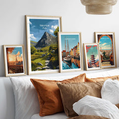 Tryfan Poster Wales Rocky Mountain Art - Scenic Welsh Highlands Print displayed among other travel posters in a cozy living room.