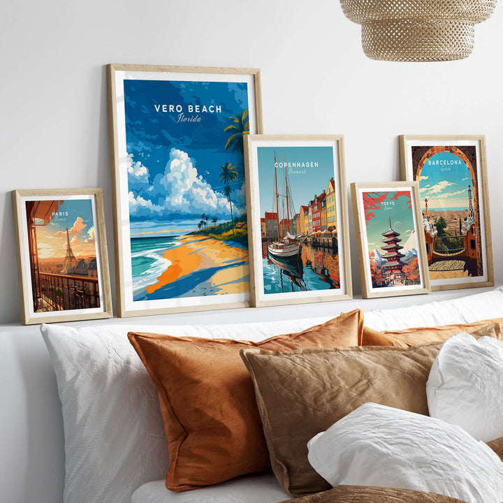 Vero Beach Florida palm tree beach poster and travel art prints displayed on a cozy bed with decorative pillows.