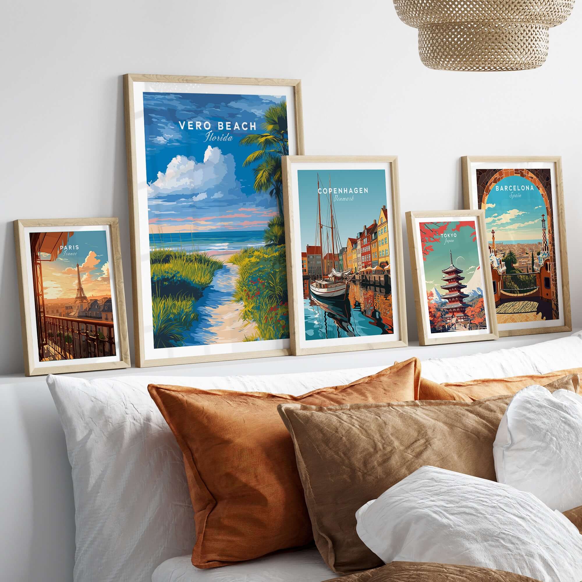 Vero Beach Florida Path to Beach Print - Coastal Flowers Wall Art displayed among other city prints on a stylish couch.