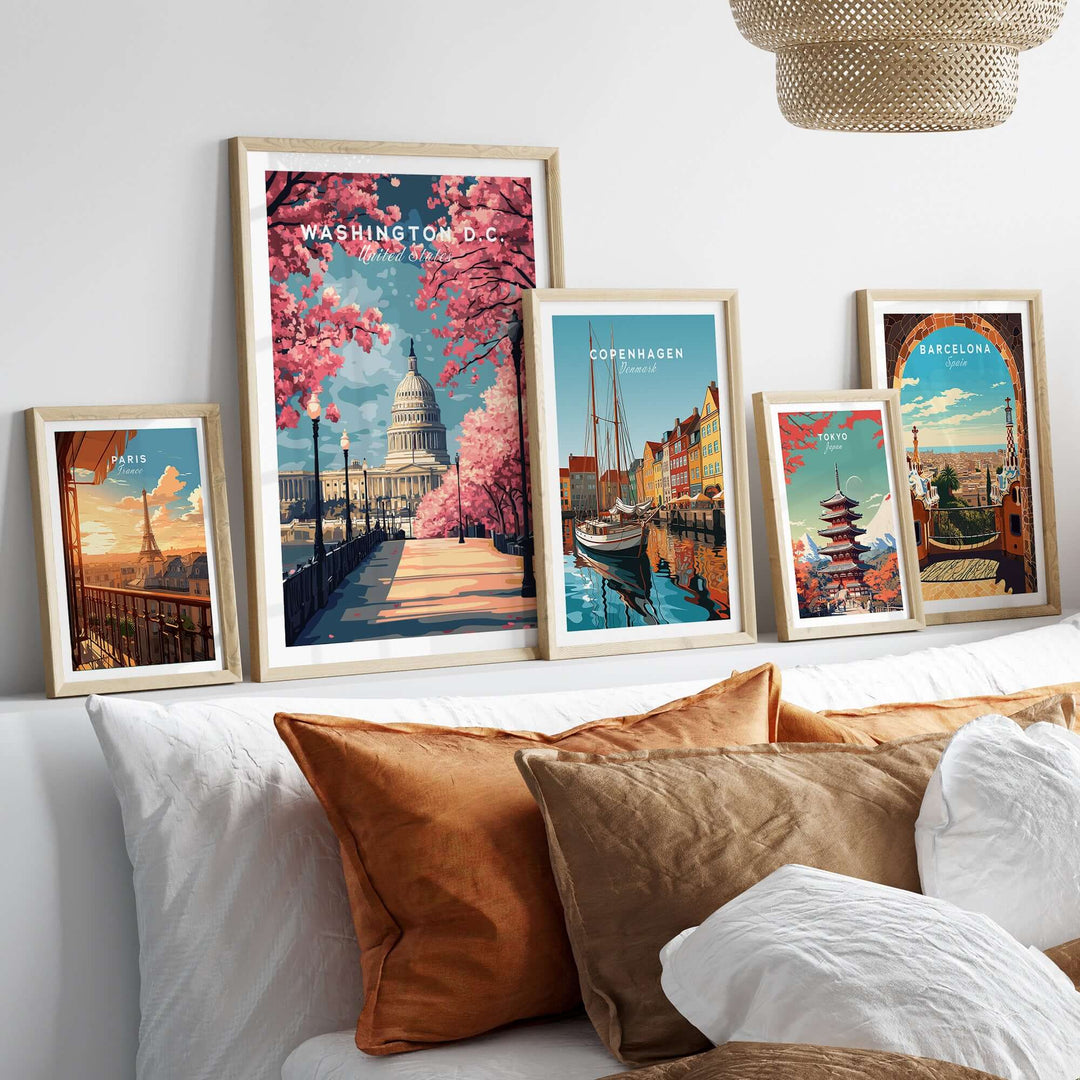 Washington D.C. Cherry Blossom Capitol print alongside vibrant cityscape posters on a cozy bedroom wall.