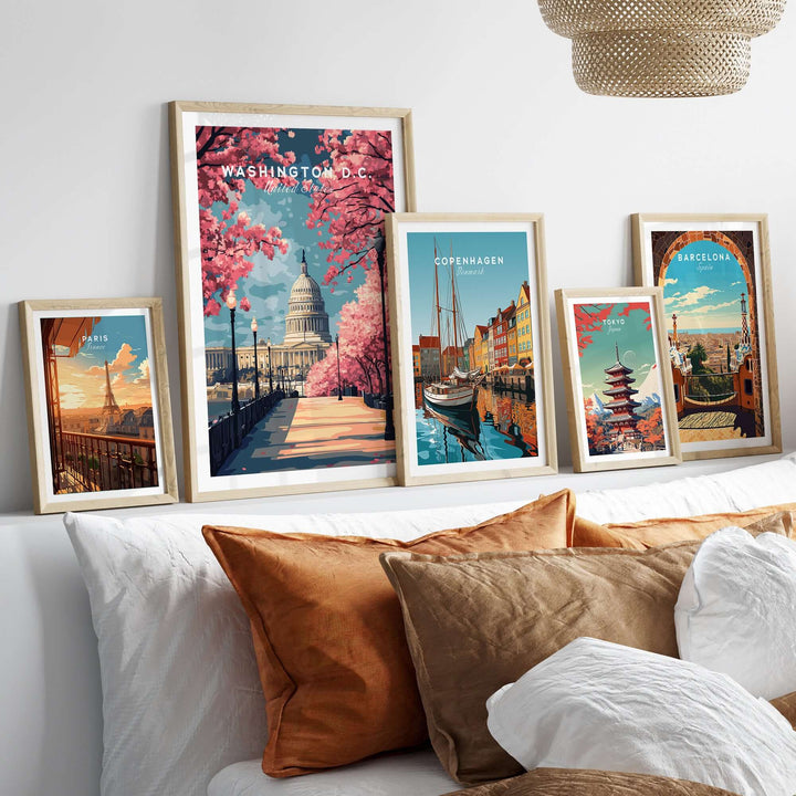 Washington D.C. Cherry Blossom Capitol print alongside vibrant cityscape posters on a cozy bedroom wall.