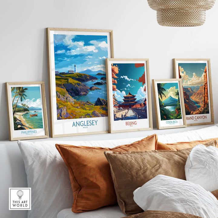 Framed prints of Anglesey, Beijing, Costa Rica, and Grand Canyon showcasing beautiful landscapes on a stylish shelf.