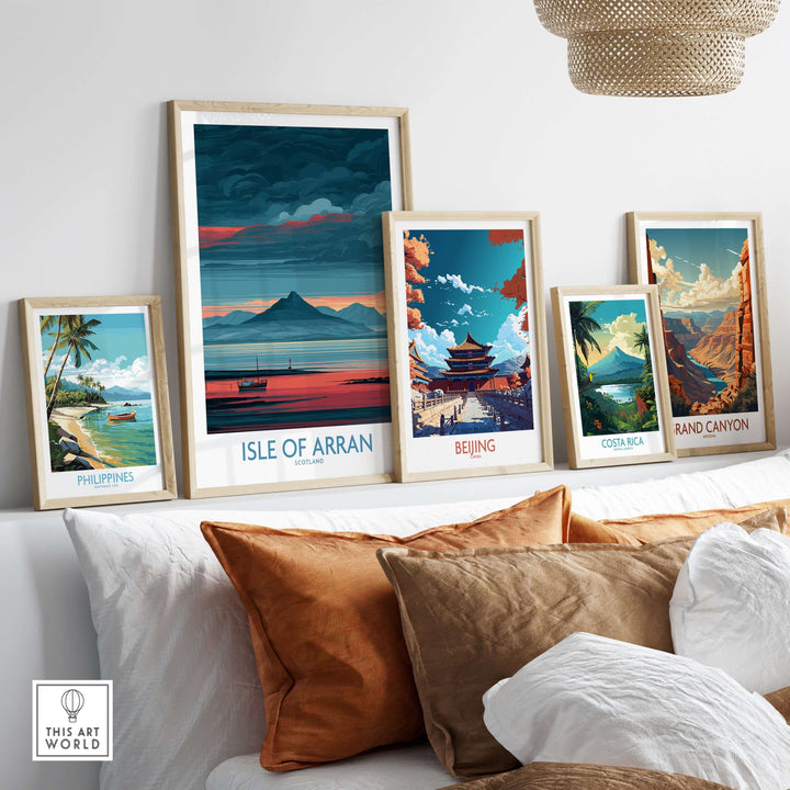Framed travel posters including Isle of Arran, showcasing coastal and scenic landscapes in a stylish home setting.