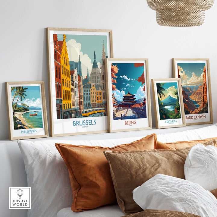 Framed prints of Brussels, Beijing, Costa Rica, and the Grand Canyon displayed on a stylish shelf.