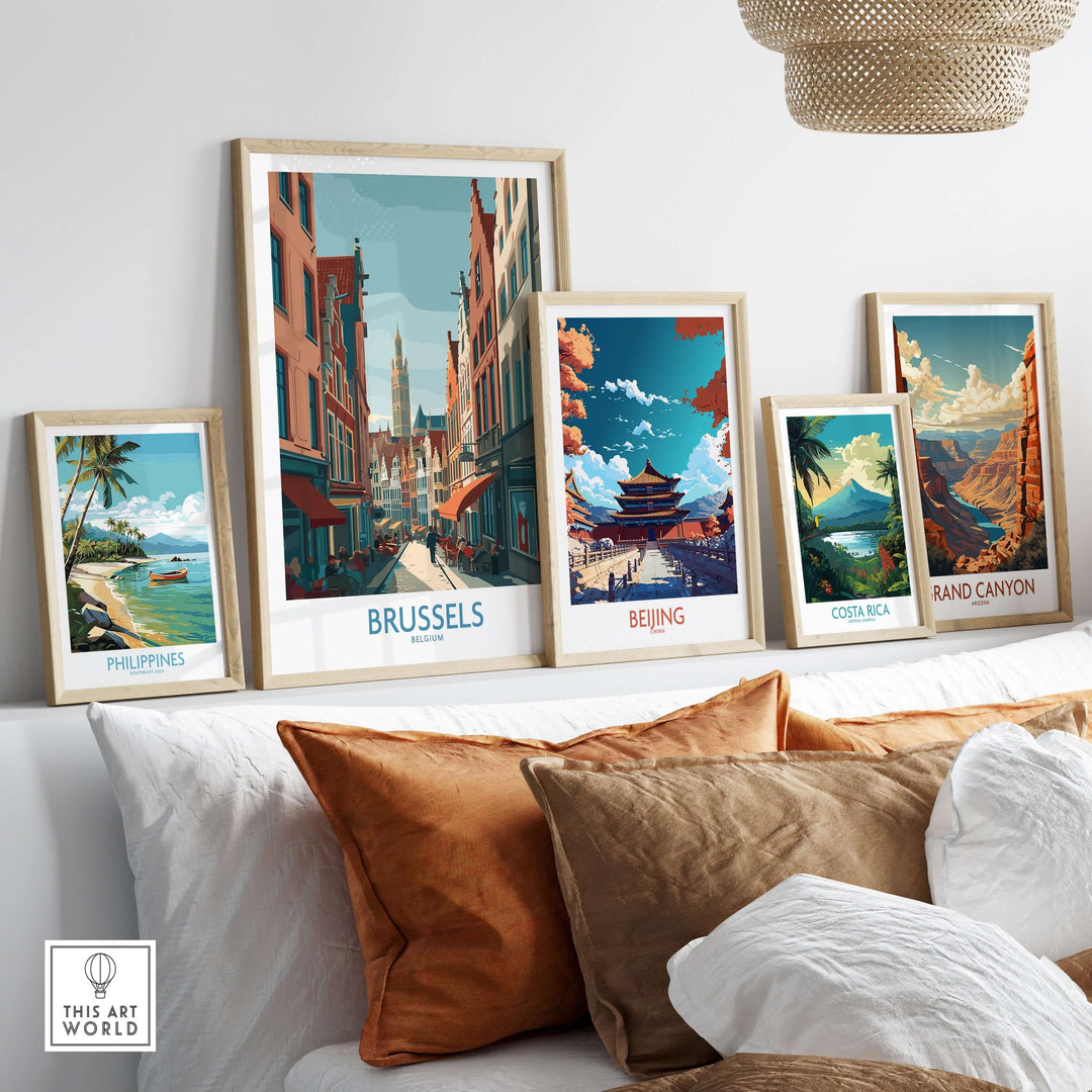 Colorful wall art featuring prints of Brussels, Beijing, Costa Rica, and the Grand Canyon, displayed above a couch.