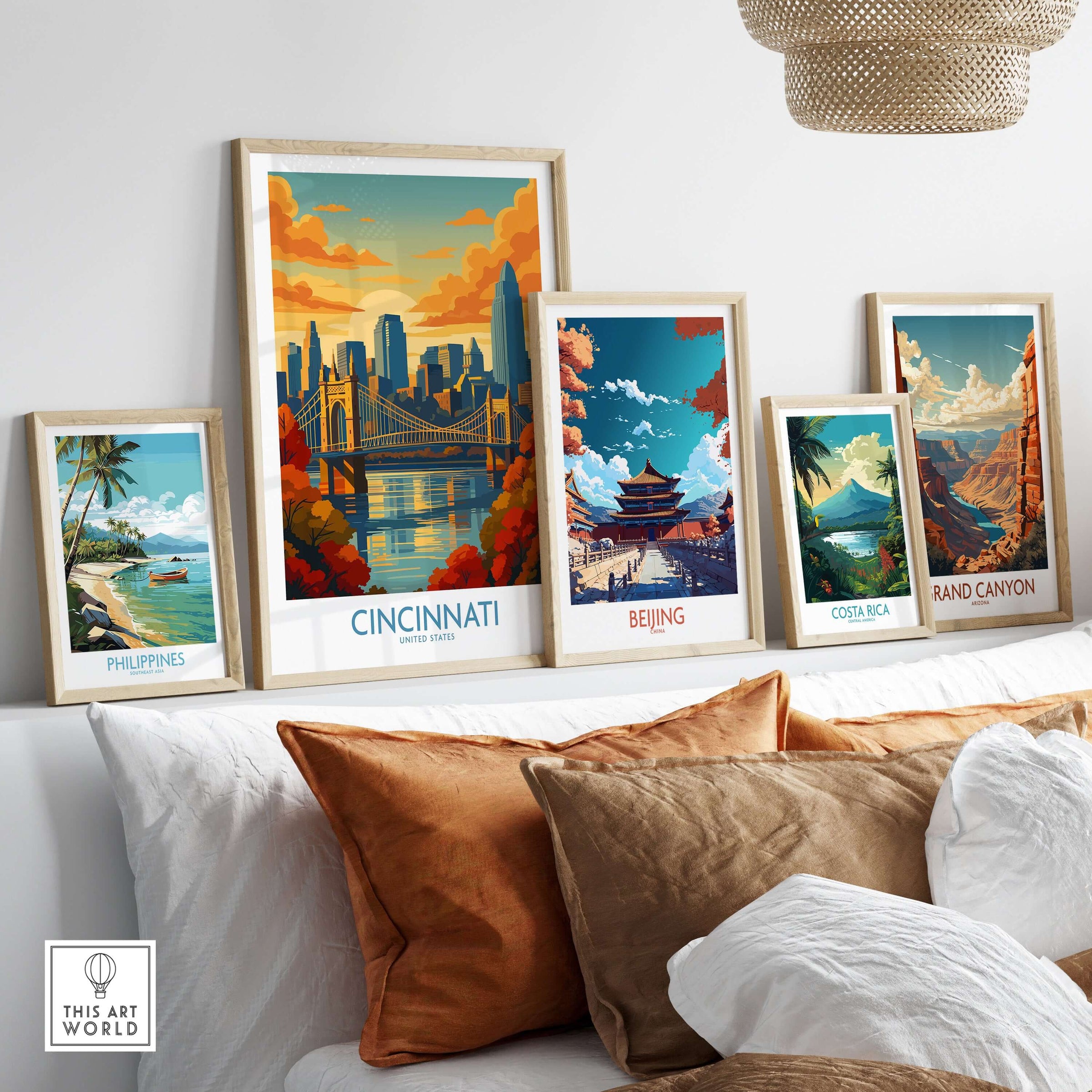 Cincinnati Skyline Print - Ohio Autumn Cityscape Decor displayed among other framed art prints on a cozy sofa.