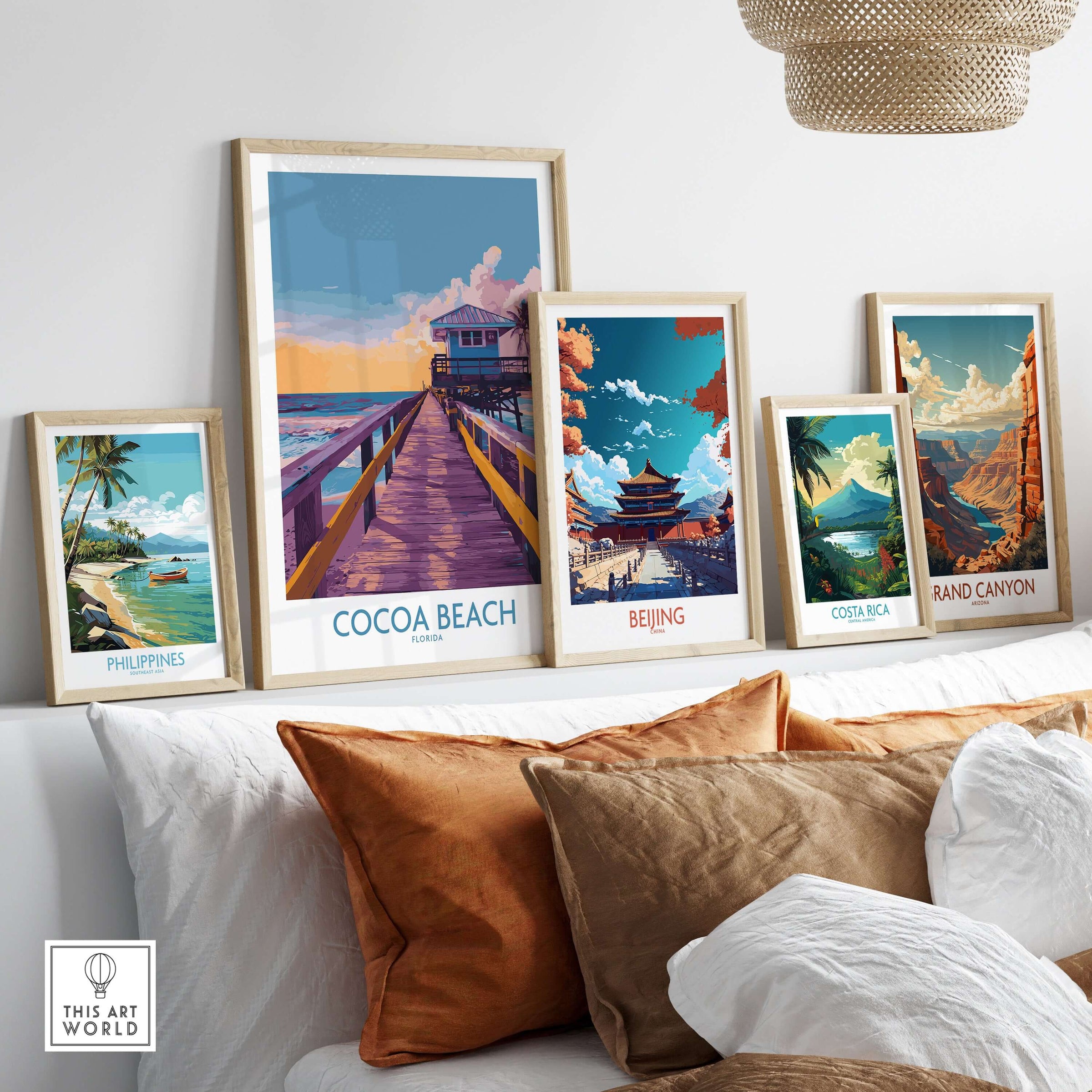 Cocoa Beach Florida Wooden Pier Poster - Golden Hour Sunset Decor displayed with other travel posters on a stylish shelf.
