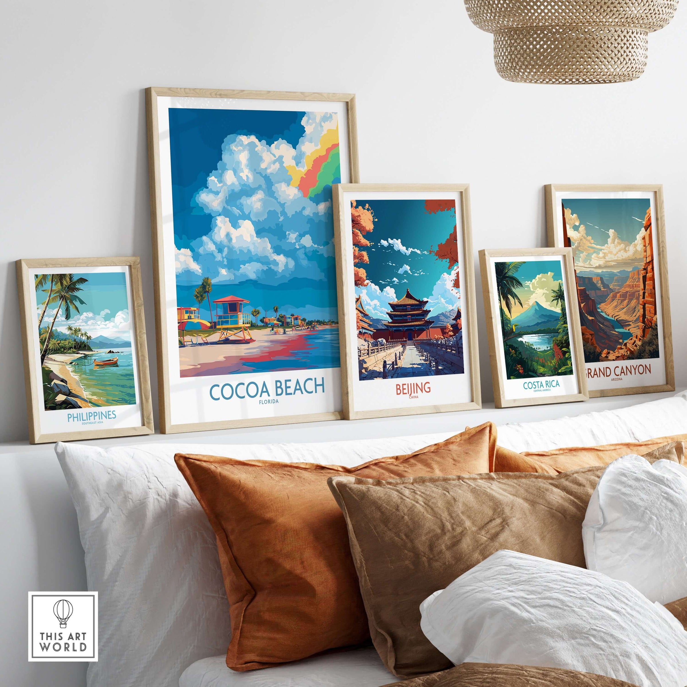 Cocoa Beach Rainbow Cloud Poster - Florida Travel Decor displayed among other travel posters in a stylish living room.