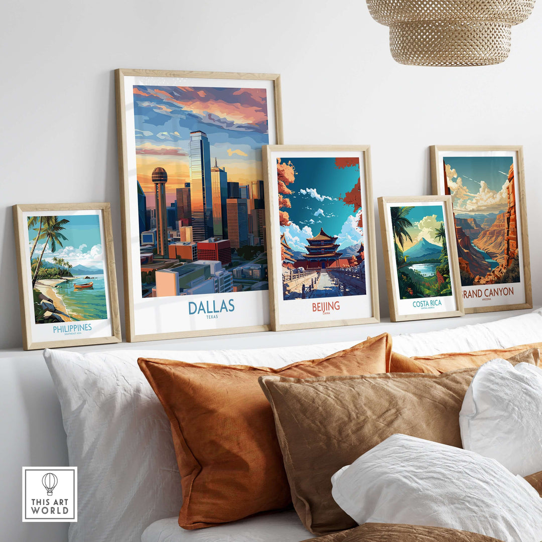 Framed travel art prints of Dallas, Beijing, Costa Rica, and Philippines displayed on a shelf with decorative cushions.