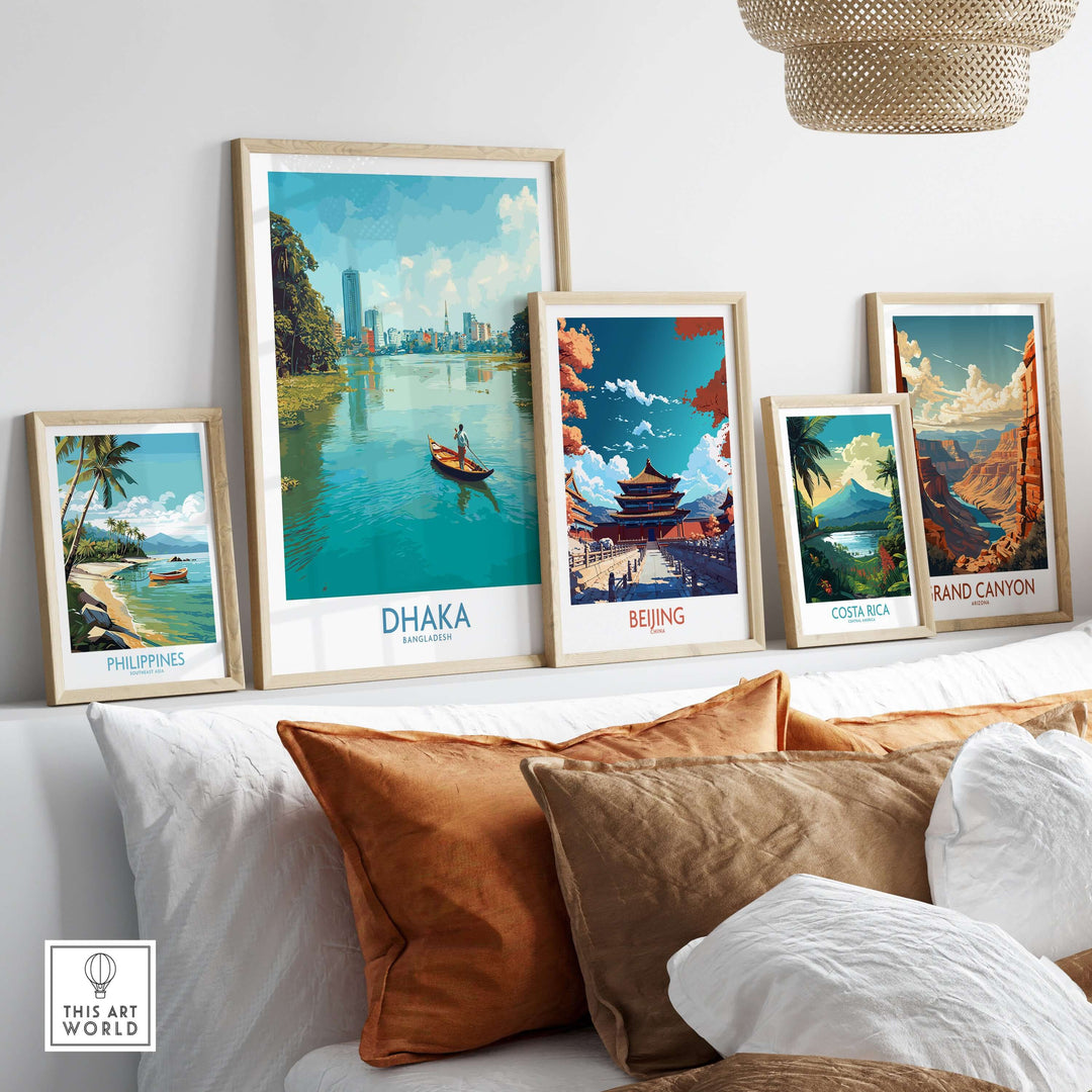 Framed posters of Dhaka, Beijing, Costa Rica, and the Grand Canyon displayed on a wall with decorative cushions.