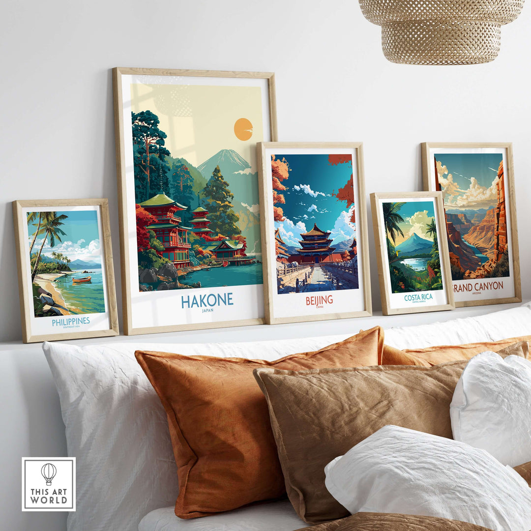Framed prints of scenic destinations including Hakone, Philippines, Beijing, Costa Rica, and Grand Canyon displayed on a wall.