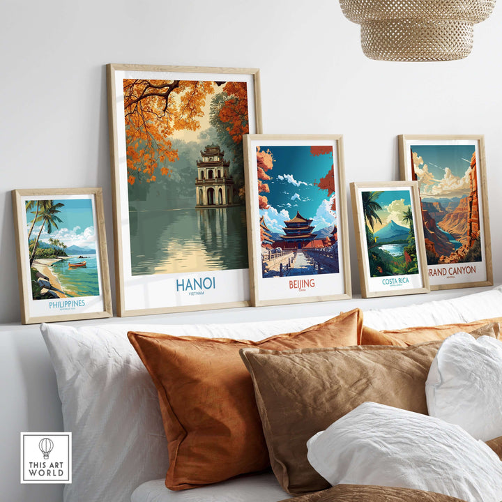 Hanoi Turtle Tower wall art among other framed travel posters on a stylish couch.