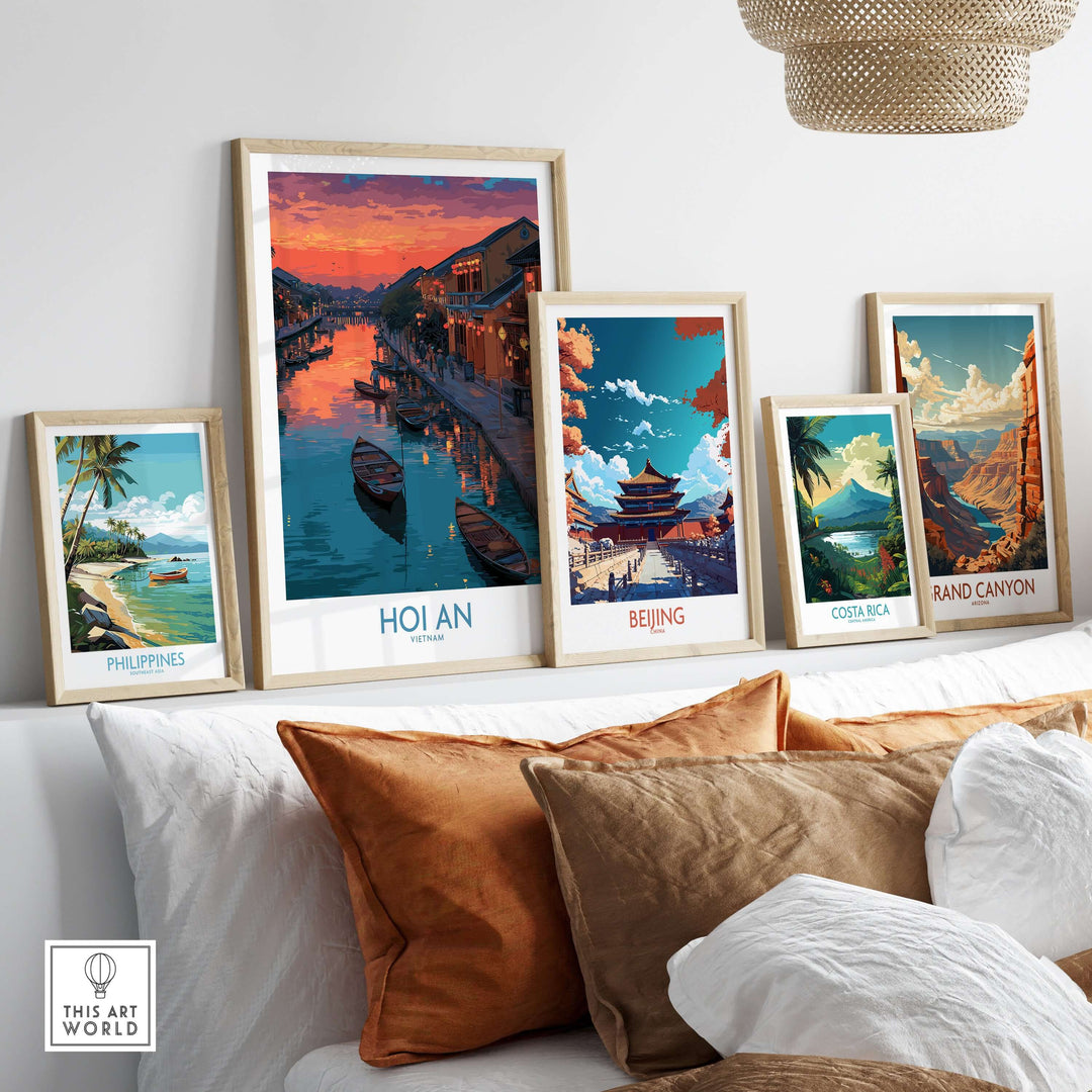 Collection of colorful travel posters including Hoi An, Philippines, Beijing, Costa Rica, and Grand Canyon on a shelf.