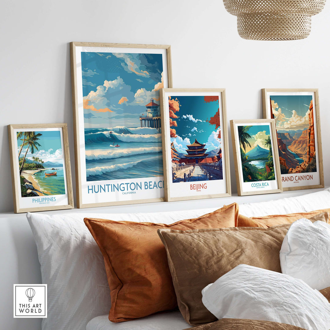 Huntington Beach California surfing poster among vibrant travel prints on a cozy sofa, enhancing beach-themed decor.