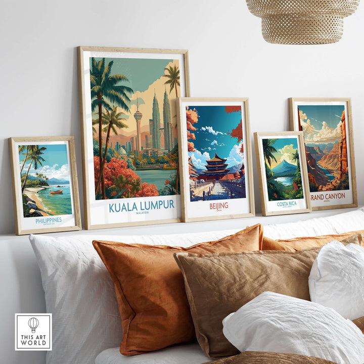 Kuala Lumpur poster and urban travel prints displayed on a shelf with vibrant landscapes and cityscapes.
