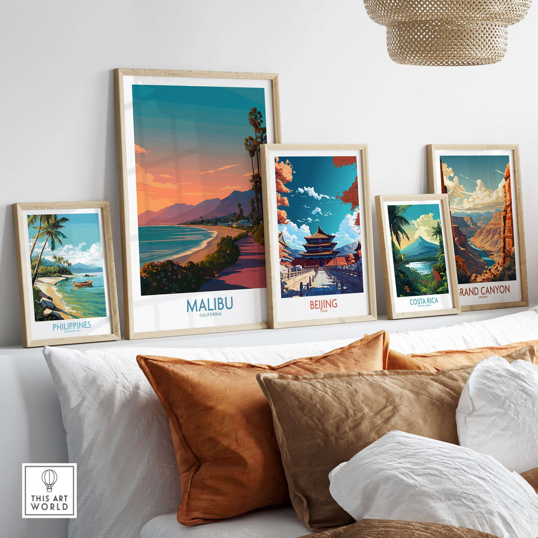 Collection of travel posters including Malibu, Beijing, Costa Rica, and the Grand Canyon displayed in a cozy living room setting.