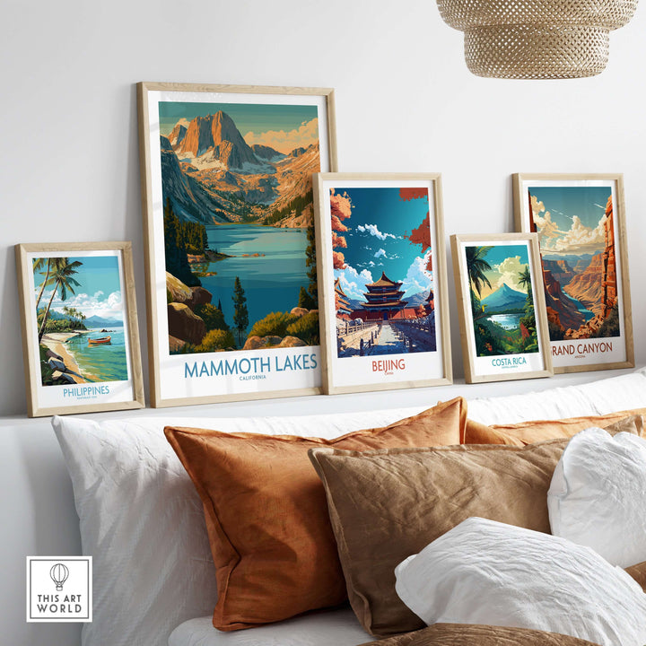 Mammoth Lakes California print along with colorful framed travel posters on a stylish shelf.