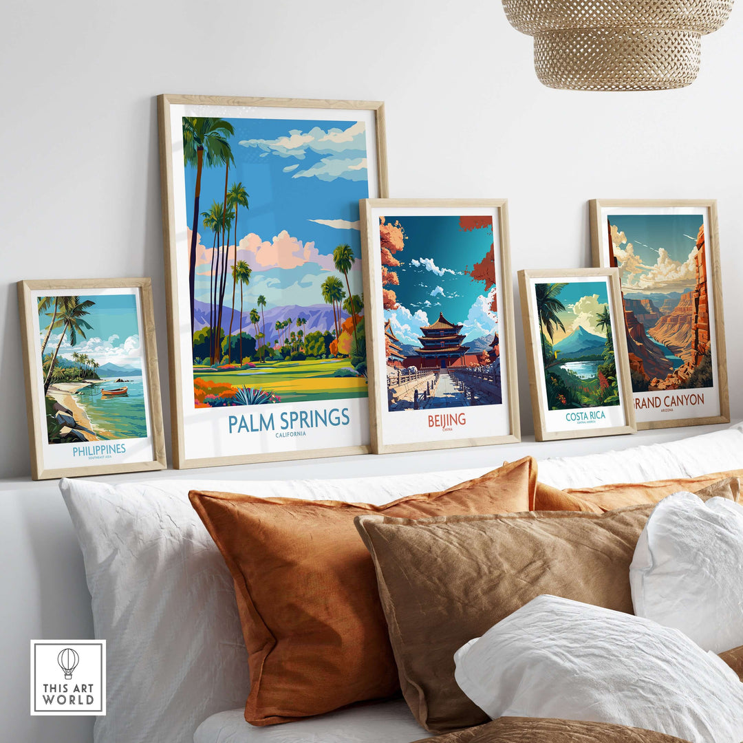 Colorful travel posters featuring Palm Springs, Beijing, Costa Rica, and the Grand Canyon on a stylish display shelf.