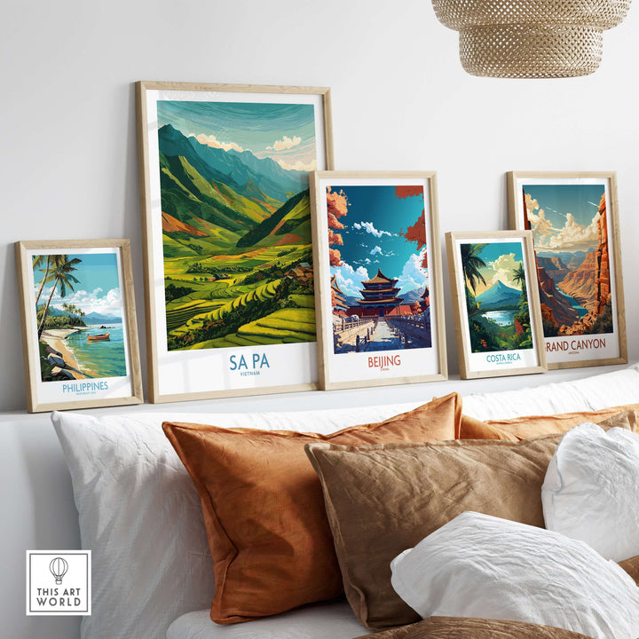 Framed travel posters including Sa Pa, Vietnam, showcasing scenic landscapes and cultural landmarks on a shelf.