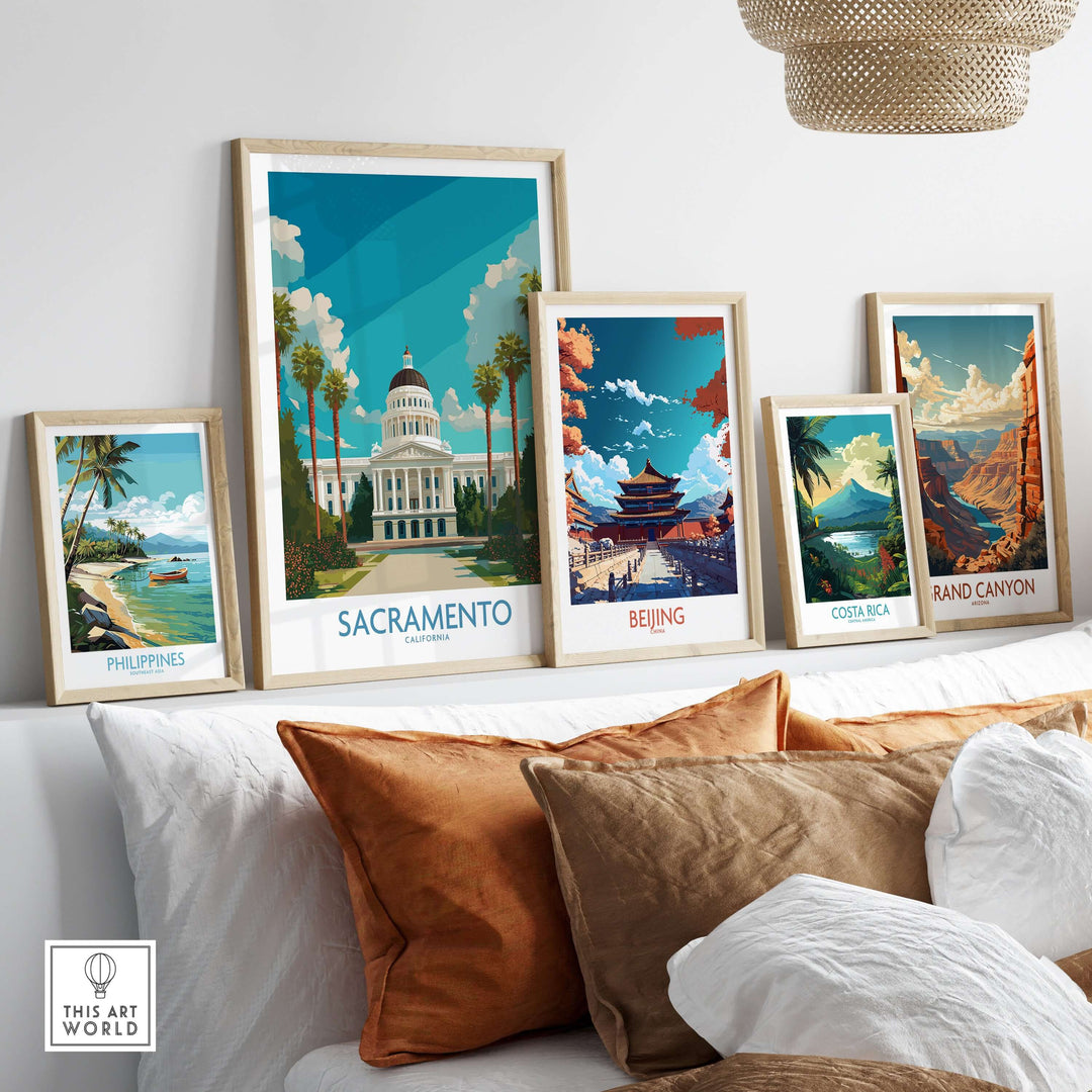 Gallery of travel-themed posters including Sacramento, Beijing, Costa Rica, and the Grand Canyon, displayed elegantly on a couch.