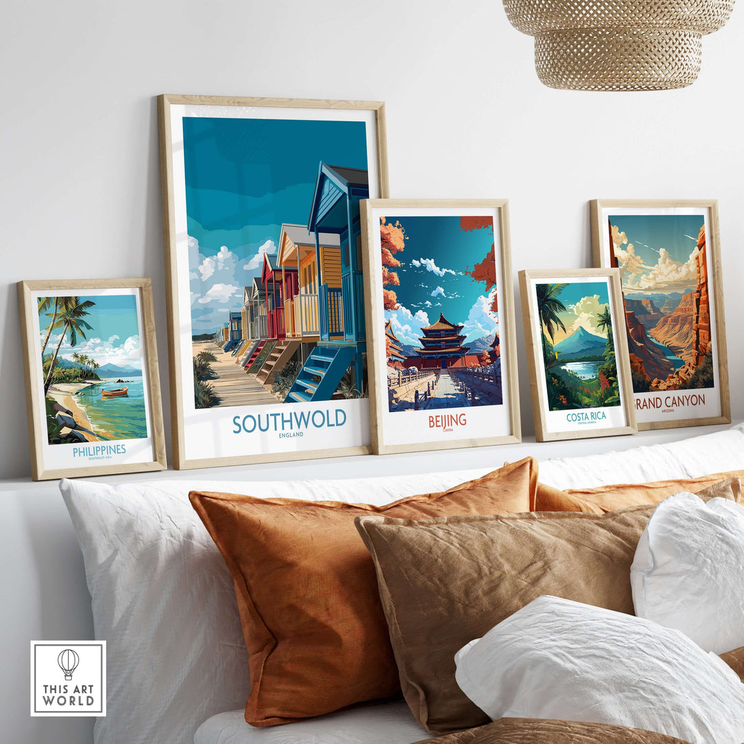 Colorful travel posters including Southwold, Beijing, Costa Rica, and the Grand Canyon displayed in a cozy living room.