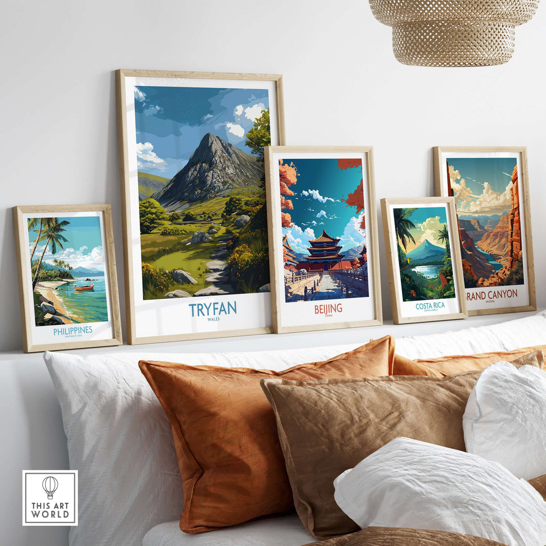 Framed Tryfan wall art among other scenic landscape prints in a stylish living room setting.
