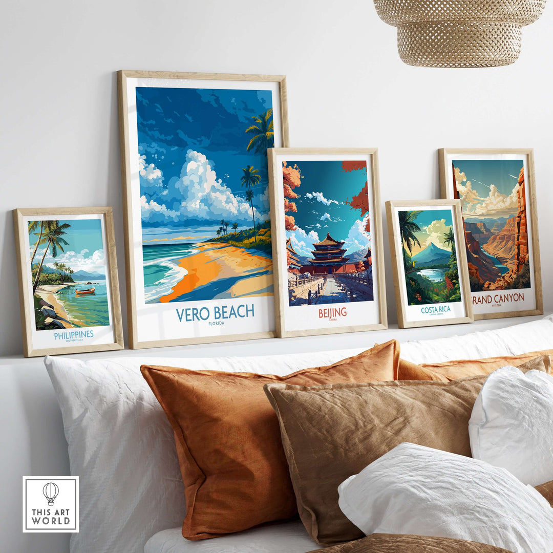 Vero Beach coastal landscape print with travel-themed art photos displayed on a stylish couch.