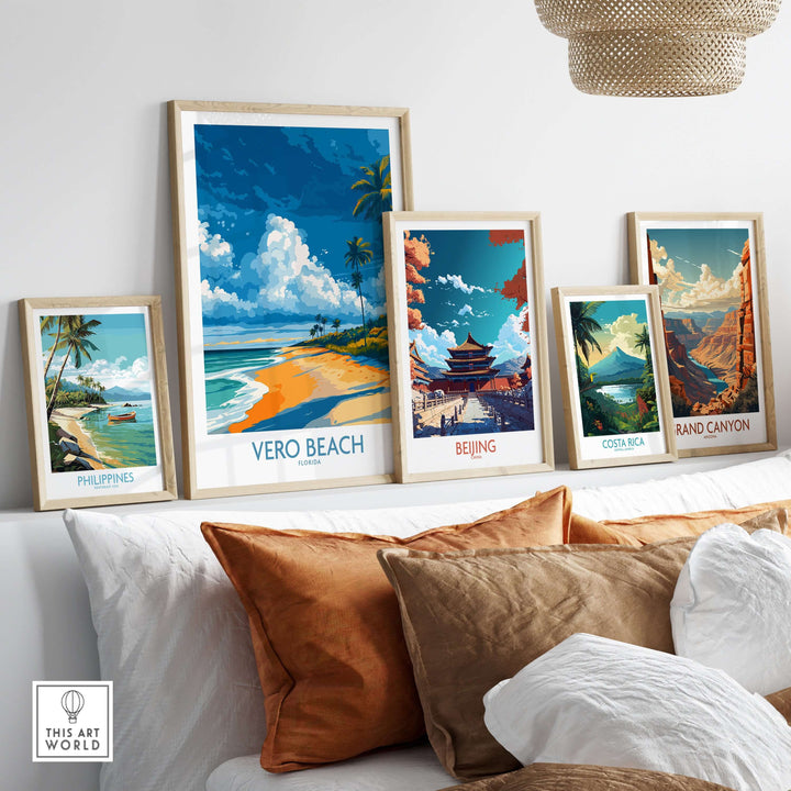 Vero Beach coastal landscape print with travel-themed art photos displayed on a stylish couch.