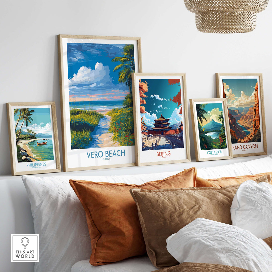 Vero Beach Ocean View poster among framed nature art prints on a cozy sofa, showcasing vibrant beach and scenic landscapes.