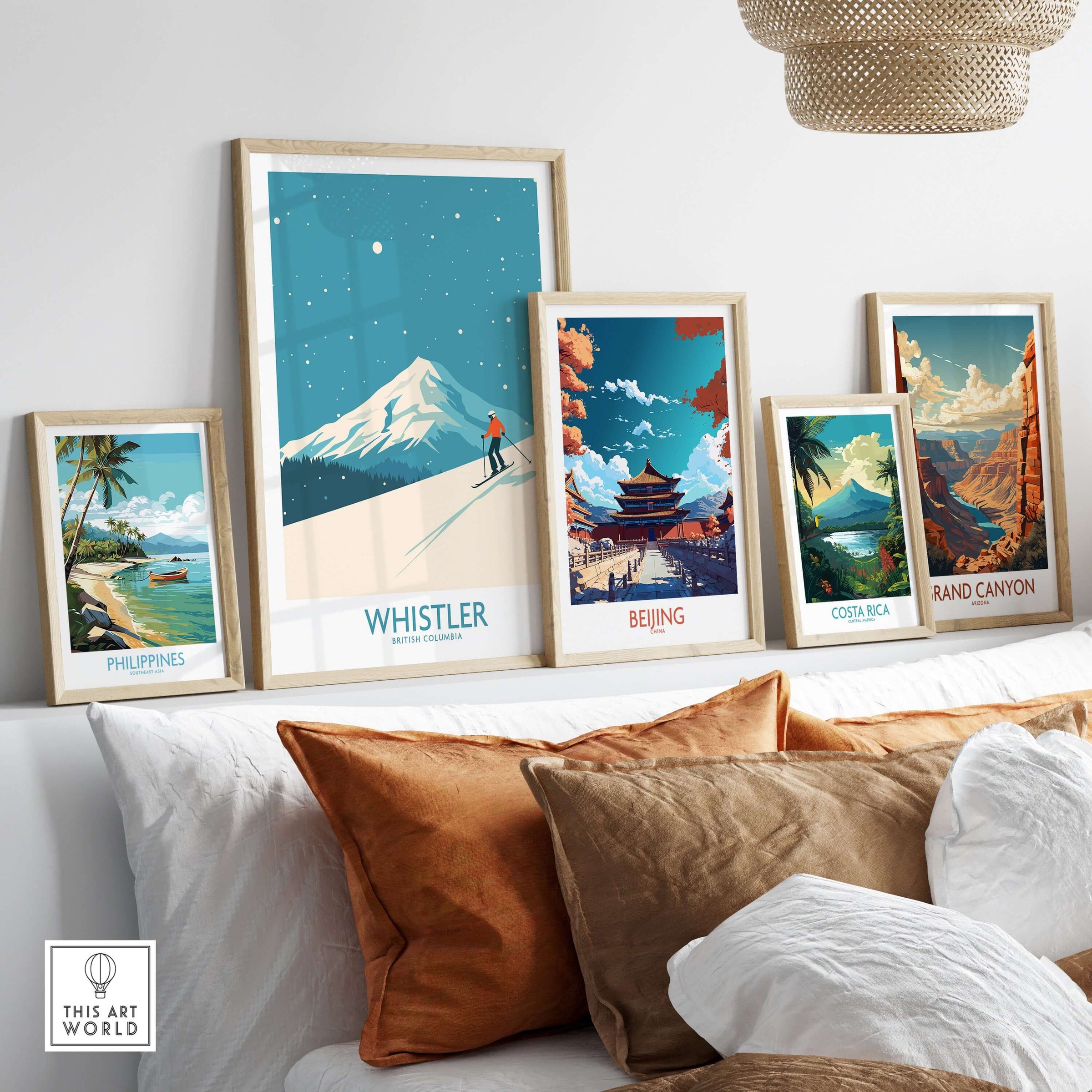 Framed Whistler Wall Art Print alongside other travel posters showcasing stunning landscapes.