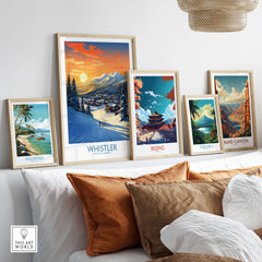 Framed Whistler ski poster surrounded by other travel-themed art prints on a cozy couch, perfect for home decor.