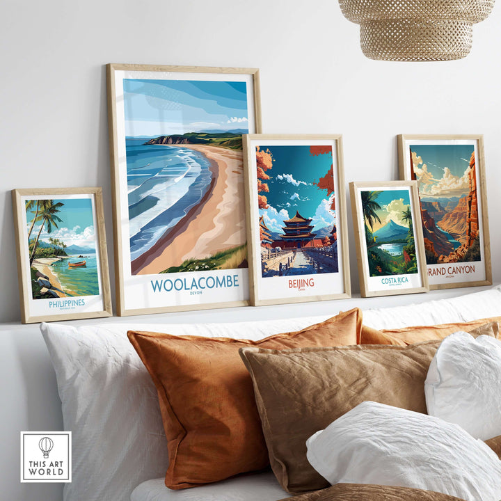 Woolacombe Devon Coastal Cliffs wall art displayed with global travel posters on a modern sofa.