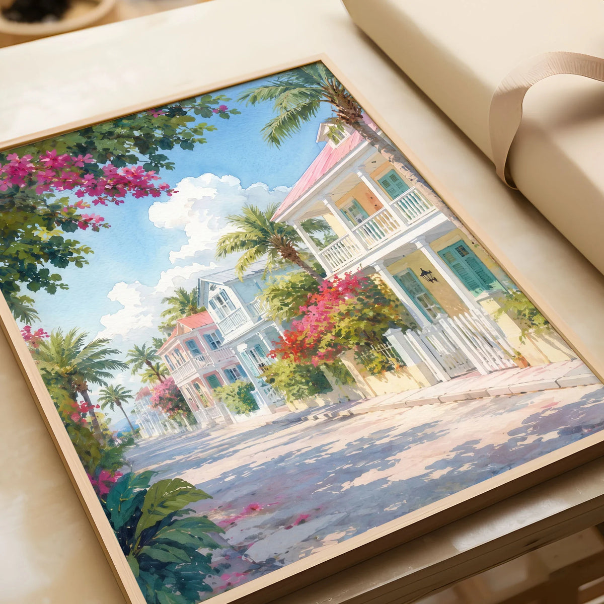 Key West pastel conch houses watercolour art print in a natural wood frame, gift close-up