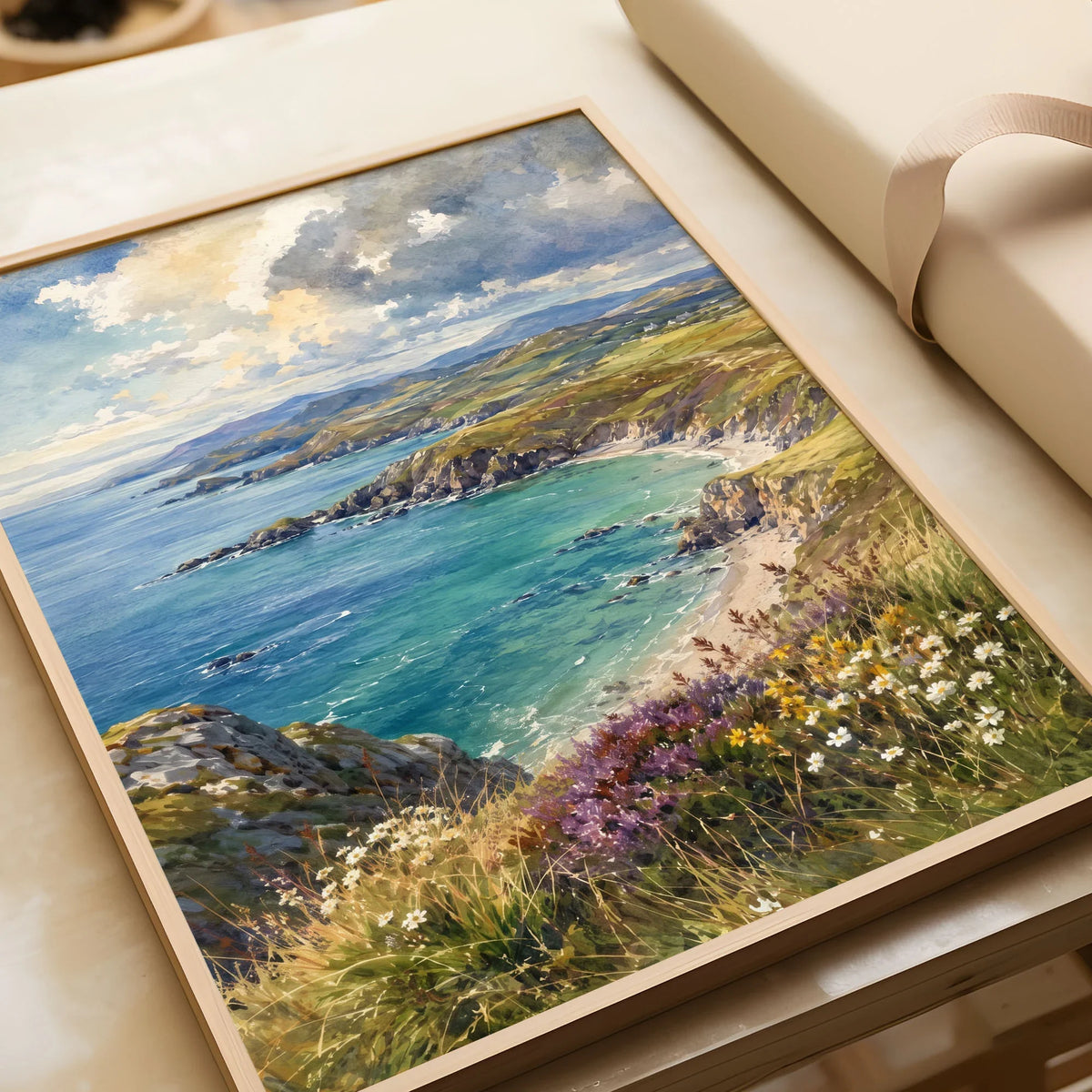 Llyn Peninsula sandy cove and coastline watercolour art print in a natural wood frame, gift close-up