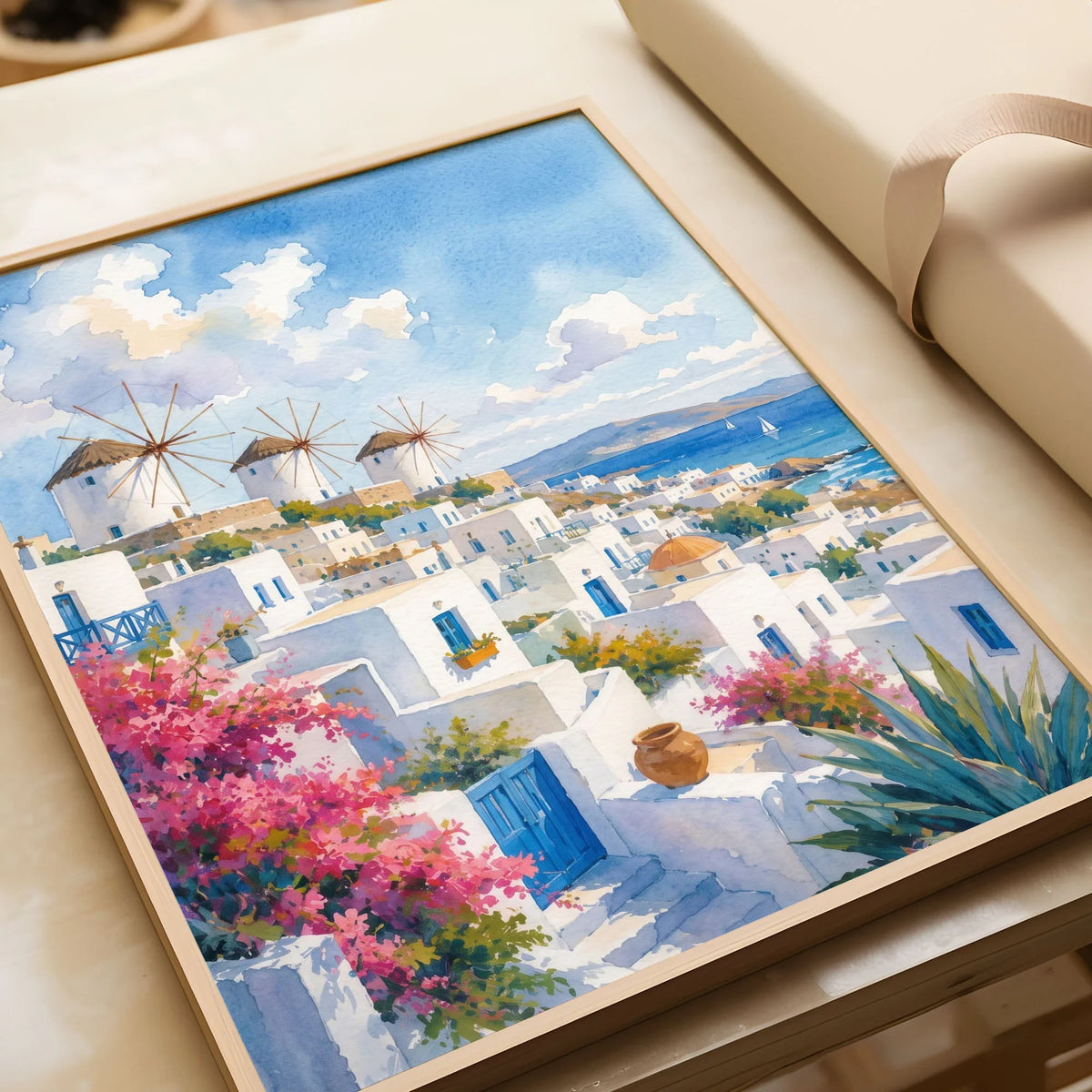 Mykonos windmills and white houses watercolour art print in a natural wood frame, gift close-up