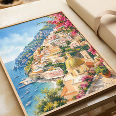 Positano cliffside village and church dome watercolour art print in a natural wood frame, gift close-up